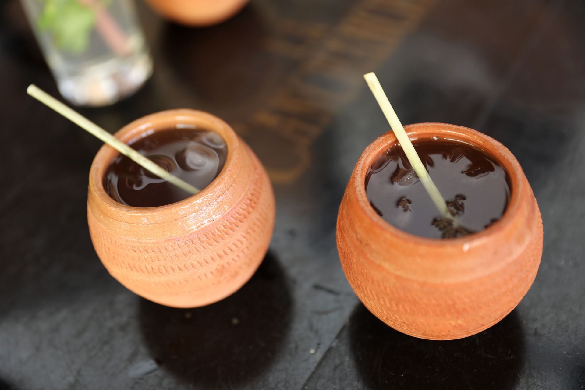 famous cuba drink served in a clay pot with honey and rum Canchanchara